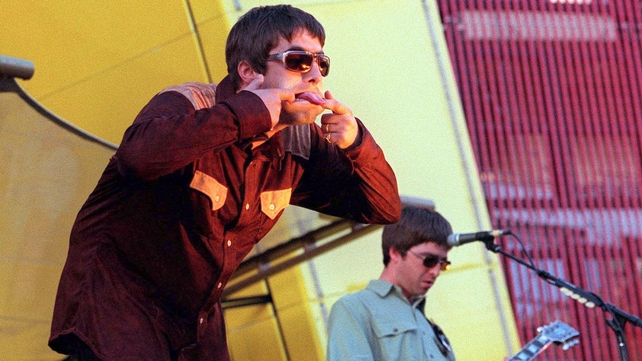 Liam and Noel Gallagher perform onstage in San Francisco supporting U2, 1997. Photo by Dave Hogan.