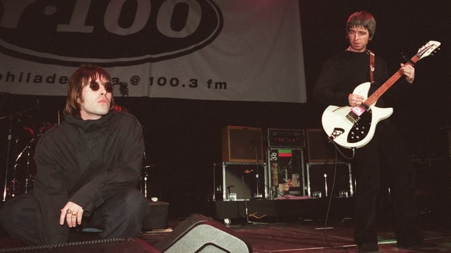 Liam and Noel Gallagher onstage in Philadelphia, 1999. Photo by Dave Hogan/Getty Images.
