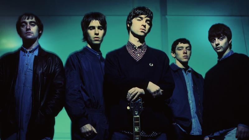 Oasis original line-up. L-R Paul Arthurs (aka Bonehead), Liam Gallagher, Noel Gallagher, Tony McCarroll, Paul McGuigan pictured at Nomad Studios in Manchester, 1993. Photo by James Fry/Getty Images.