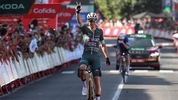 Wout van Aert celebrates at the finish line after winning stage 10