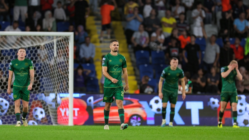 Zachary Elbouzedi, centre, and his team-mates react after conceding their side's second goal