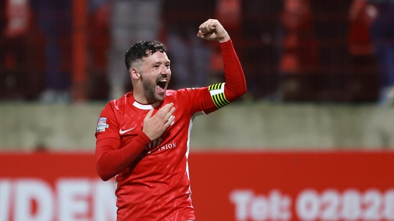 Tomas Cosgrove celebrates Larne's famous night