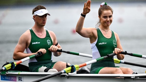Tiarnán O'Donnell and Katie O'Brien salute the Irish fans after their fourth-place in their PR2 mixed double sculls heat