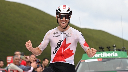 Michael Woods celebrates his stage win