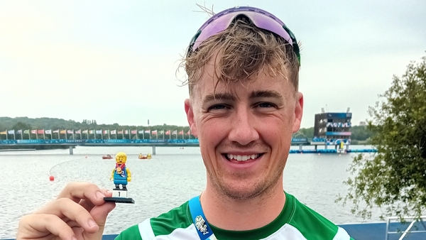 Tiarnán O'Donnell with his lucky charm, a Lego mini figurine that remains in his sock for every race