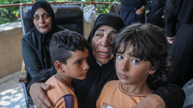 Relatives of five Palestinians killed in a Israeli army's attack on the apartment belonging to the Abu Bakr family, mourn as the bodies are brought to Nasser Hospital in Gaza