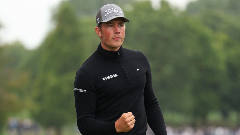 Denmark's Niklas Norgaard celebrates a birdie on 18