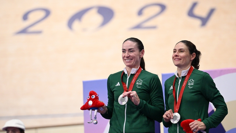 Eve McCrystal, left, and Katie George Dunlevy with their silver medals
