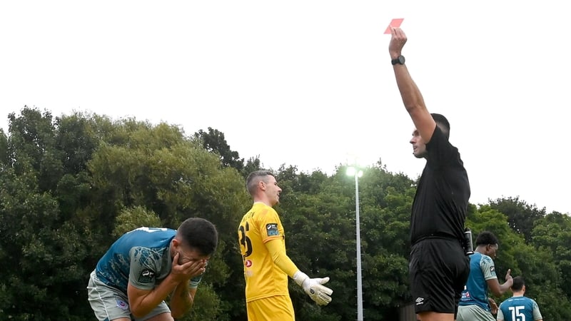 Luke Heeney reacts to the red card for handball on the line