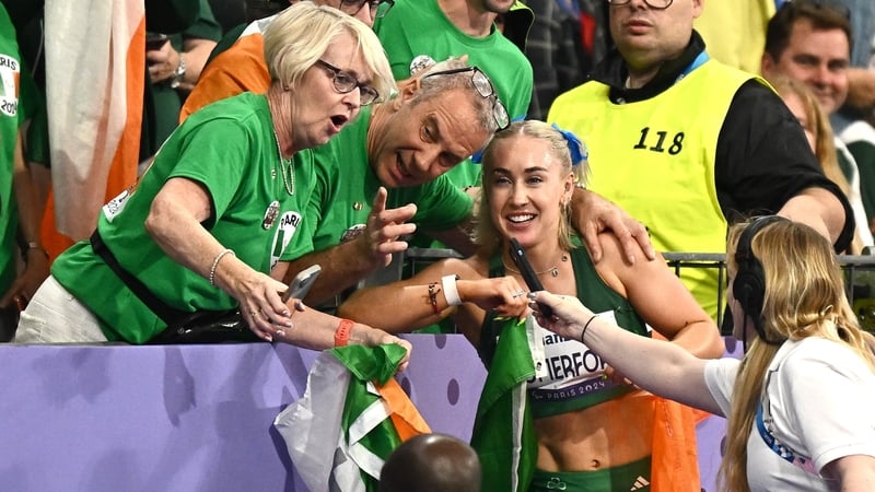 Orla Comerford celebrates with her parents Ger and Siobhan after winning bronze