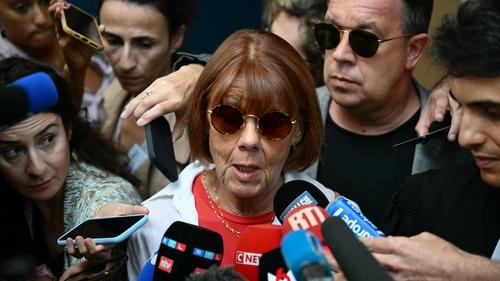 Gisele P with her son David (wearing shades) outside the court in Avignon, which heard that she had been drugged and raped around 200 times