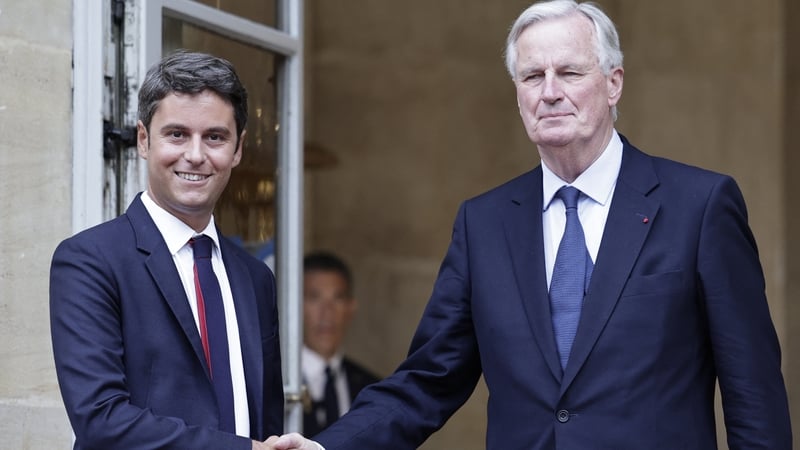 Newly appointed Prime Minister Michel Barnier (R) with outgoing prime minister Gabriel Attal (L) during the handover ceremony