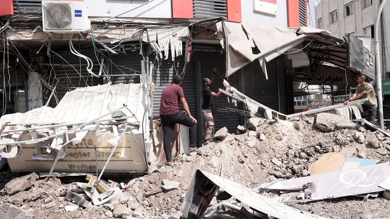 Buildings are destroyed as Israeli forces appeared to withdrawing from the West Bank city of Jenin following down a ten-day raid