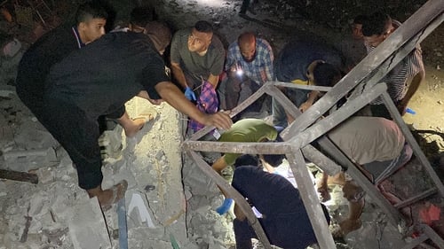 People search through the rubble of Mohammed Morsi's home in Jabalia for any survivors