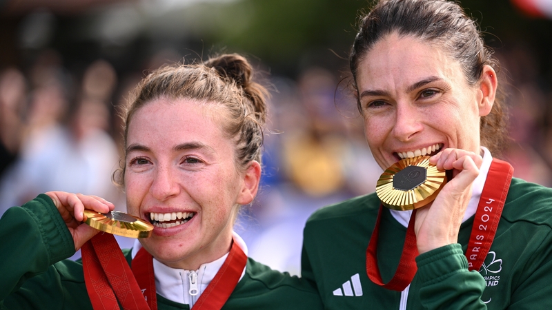 Katie-George Dunlevy, right, and pilot Linda Kelly of Ireland celebrate with their gold medals