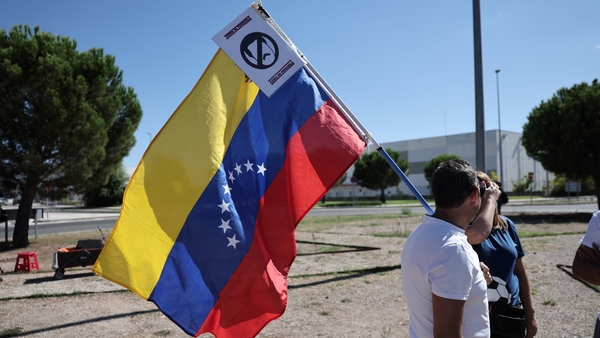 Supporters of Edmundo Gonzalez gathered near the airport in Spain he arrived at