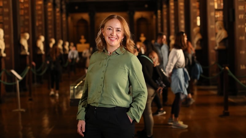 Catherine Flanagan, the CEO of AVEA, at the Book of Kells in Trinity College