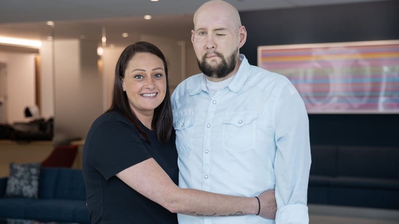 Aaron James with his wife, Meagan, who recounted that, after his marathon surgery, she had been able to kiss him for the first time in two years