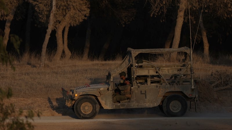 An Israeli military vehicle is seen on patrol near the Israel-Gaza border