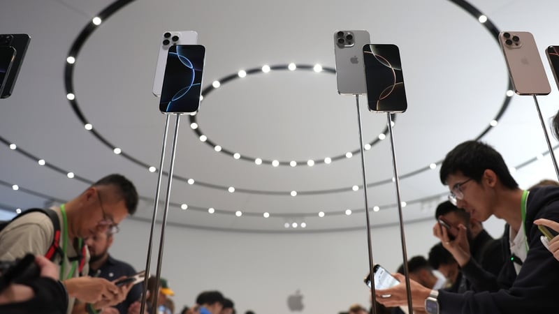 Attendees inspect the new iPhones at Apple headquarters in Cupertino, California. Photo: Justin Sullivan/Getty Images