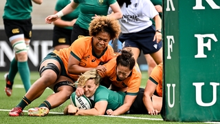 Aoife Dalton scores Ireland's first try despite the tackle of Faitala Moleka