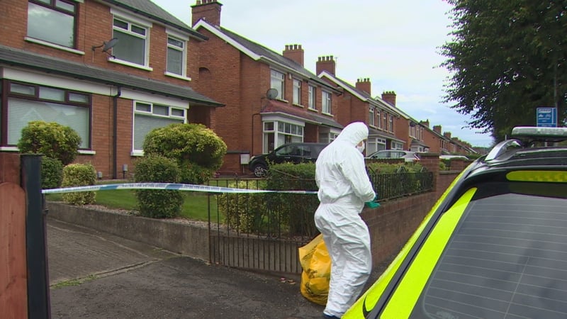 The woman's body was found in a garage beside the property