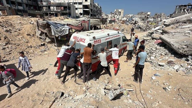 Healthcare workers and first aid teams work to help those affected by Israeli attacks in Gaza City