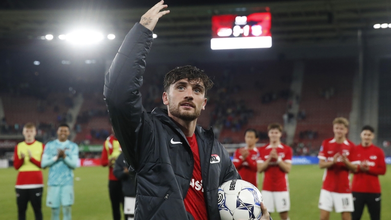 Troy Parrott, match ball in hand, salutes the Alkmaar crowd