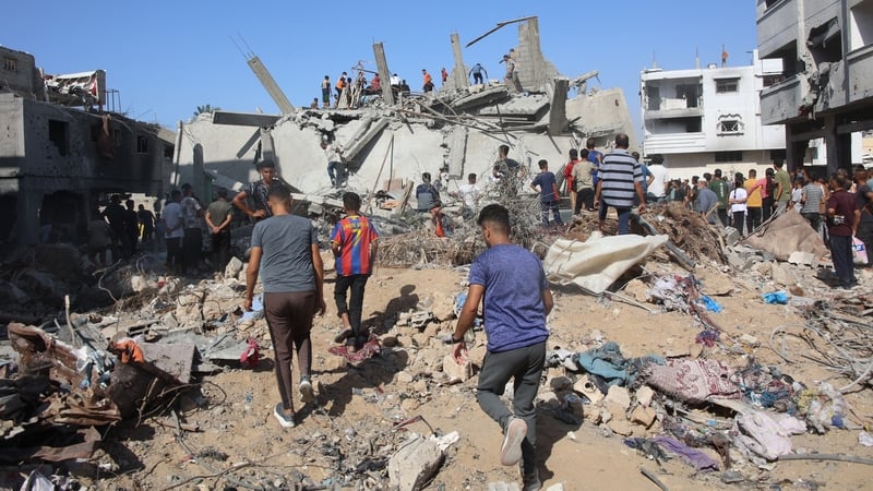 Palestinians search in the rubble for survivors at the site of an Israeli strike in the Shejaiya suburb east of Gaza City