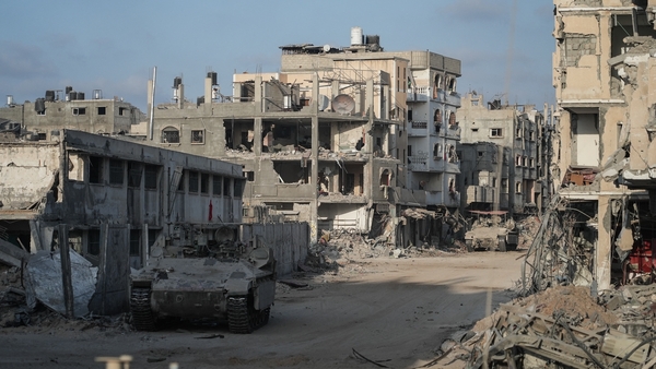 Israeli tanks patrolling empty streets and past buildings destroyed by previous Israeli strikes in Rafah