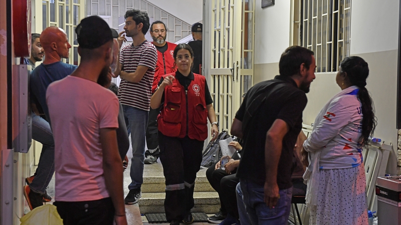 People gather at a Red Cross building in Beirut to donate blood following calls from the Lebanon's Health Ministry after the pager explosions