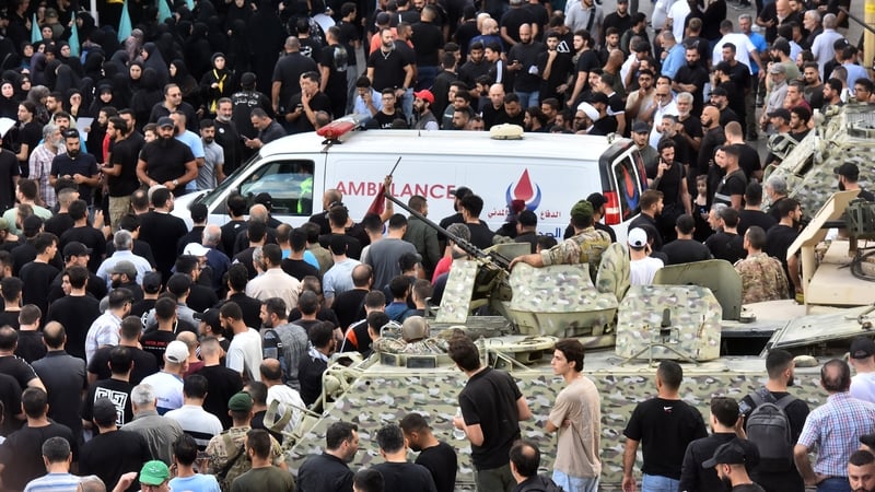 An ambulance arrives after a reported device explosion occurred during the funeral of people killed by pager detonations in Lebanon