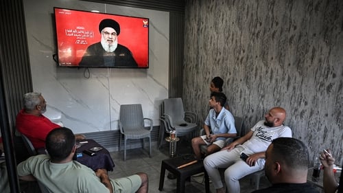 People watching a televised address by Hassan Nasrallah on 19 September