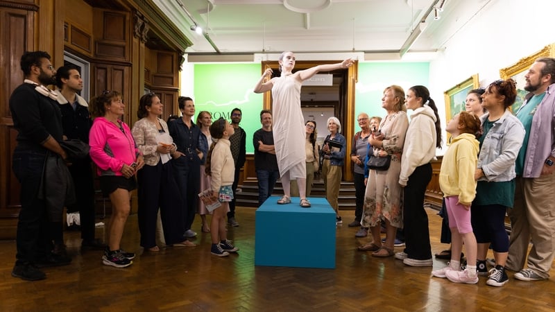Crowds gather to look at the living statues exhibit at the Crawford Art Gallery in Cork