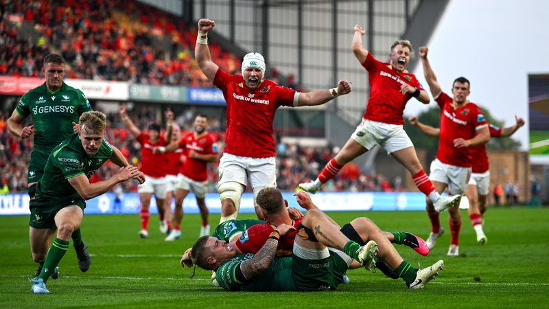 Munster players celebrate as team-mate Gavin Coombes crosses for a second-half try against Connacht at Thomond Park