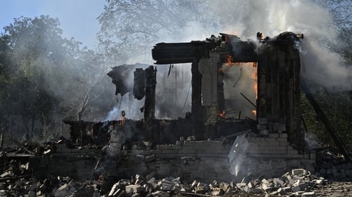 Smoke emanates from a fire on a destroyed house in the city of Pokrovsk in the Donetsk region of Ukraine