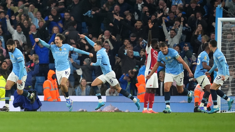 Manchester City players celebrate John Stones' dramatic late equaliser