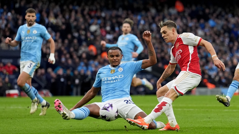 Manchester City's Manuel Akanji blocking a shot from Arsenal's Leandro Trossard, who was later sent off