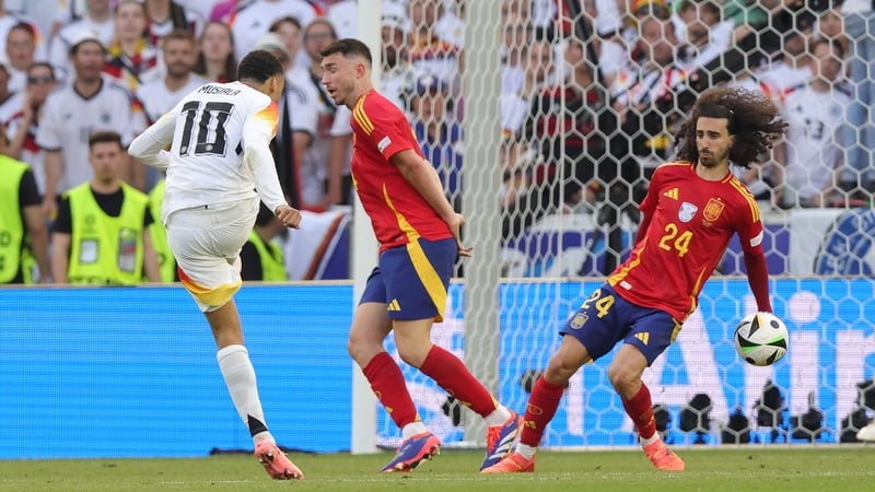 Marc Cucurella blocks Jamal Musiala's shot with his arm in the quarter-final between Spain and Germany