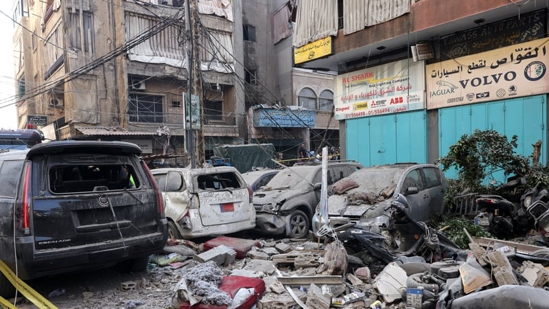 Destroyed cars pictured under a residential building whose top two floors were hit by an Israeli strike in Beirut
