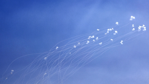 Rockets fired from southern Lebanon are intercepted by Israel's Iron Dome air defence system over the Upper Galilee region in northern Israel