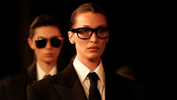 Bella Hadid showcased a gender-fluid ensemble on the Saint Laurent runway (Vianney Le Caer/AP)