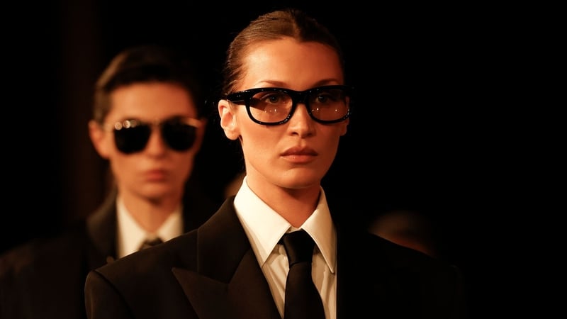 Bella Hadid showcased a gender-fluid ensemble on the Saint Laurent runway (Vianney Le Caer/AP)