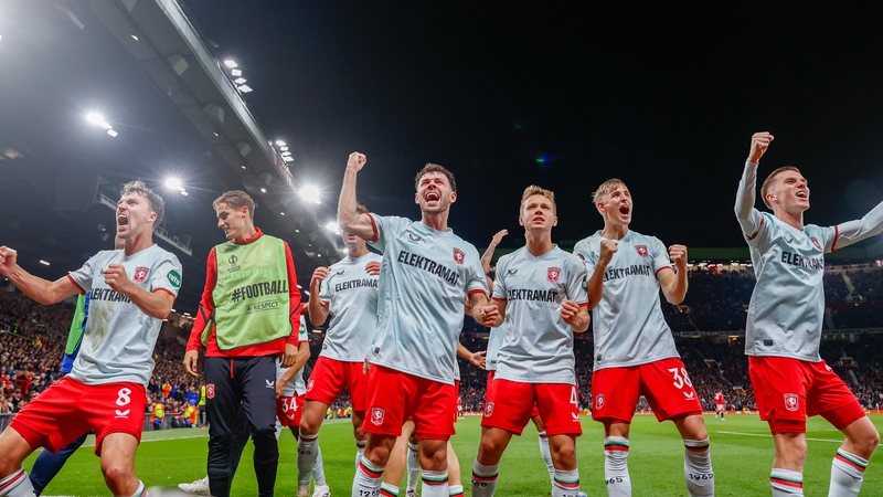 FC Twente players celebrate their draw at Old Trafford