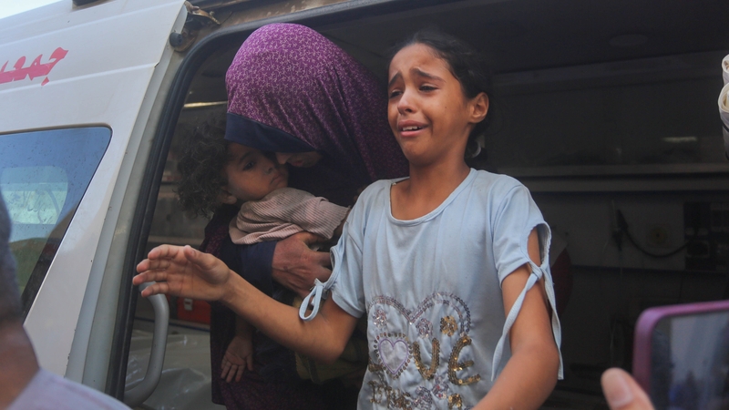 Injured children are brought to hospital following an Israeli strike on Deir al-Balah in Gaza