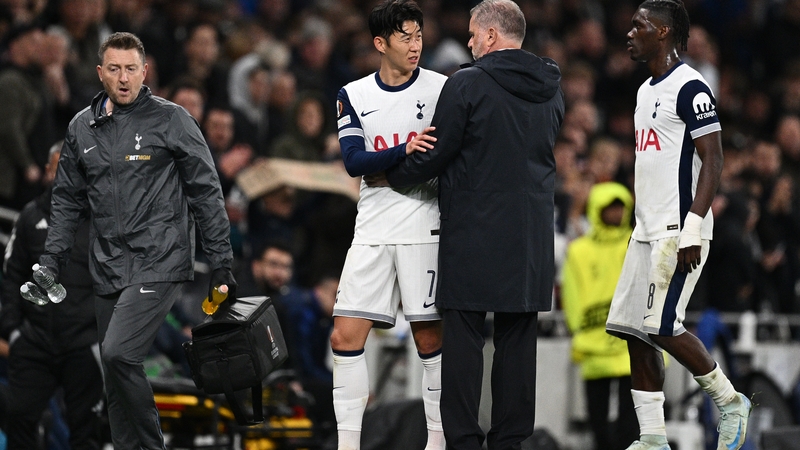 Tottenham Hotspur manager Ange Postecoglou speaks to his captain Son Heung-Min, who went off injured lsat night