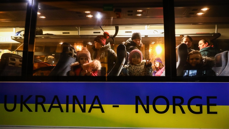 Ukrainian refugees are seen on a bus travelling to Norway in March 2022