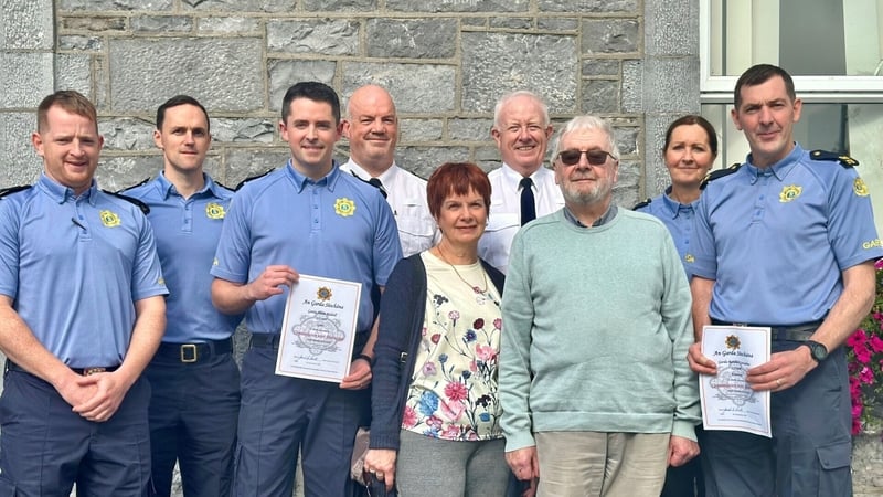 Garda Shane Riddell, third from left, and Garda Randal Considine, far right, with Killian Kenny at Gort Garda Station