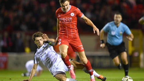 Sean Boyd is tackled by Niall Morahan of Sligo Rovers