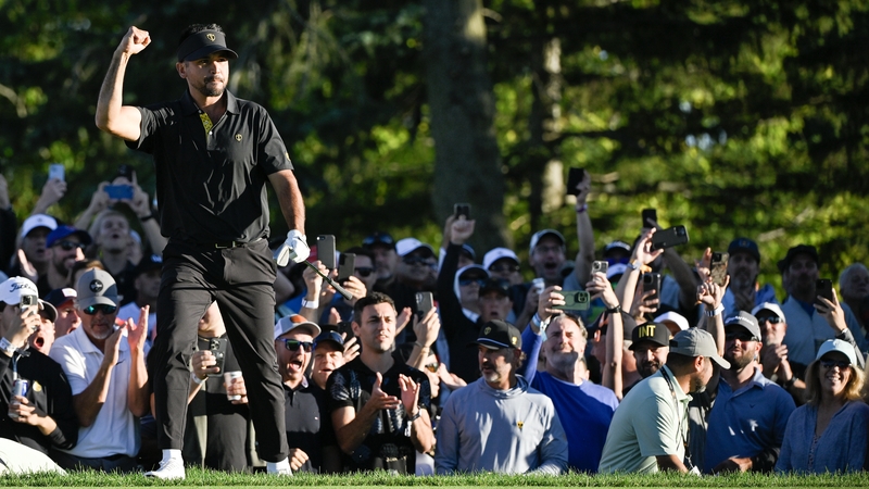 Jason Day celebrates his match-winning putt on the 18th green